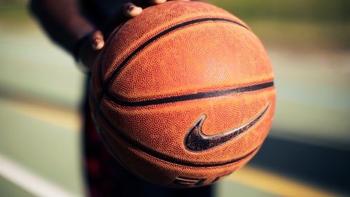 close up of orange basketball with Nike tick