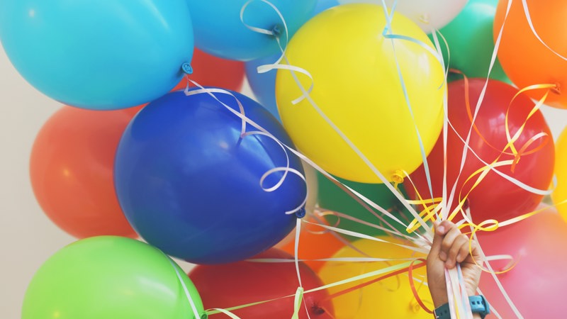 a bunch of colourful balloons 