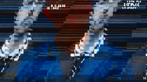 Person in Scotland football shirt alongside a logo reading Kitback