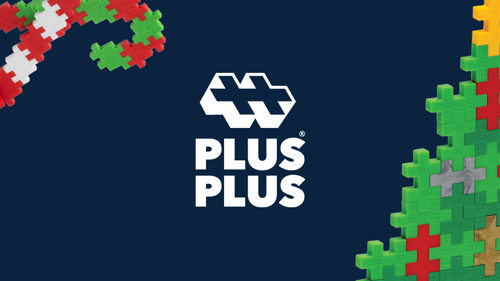Dark blue background featuring the Plus-Plus logo in white at the center. On the left, a candy cane made of interlocking Plus-Plus pieces in red, white, and green. On the right, part of a Christmas tree built from Plus-Plus pieces in green, red, gray, and yellow